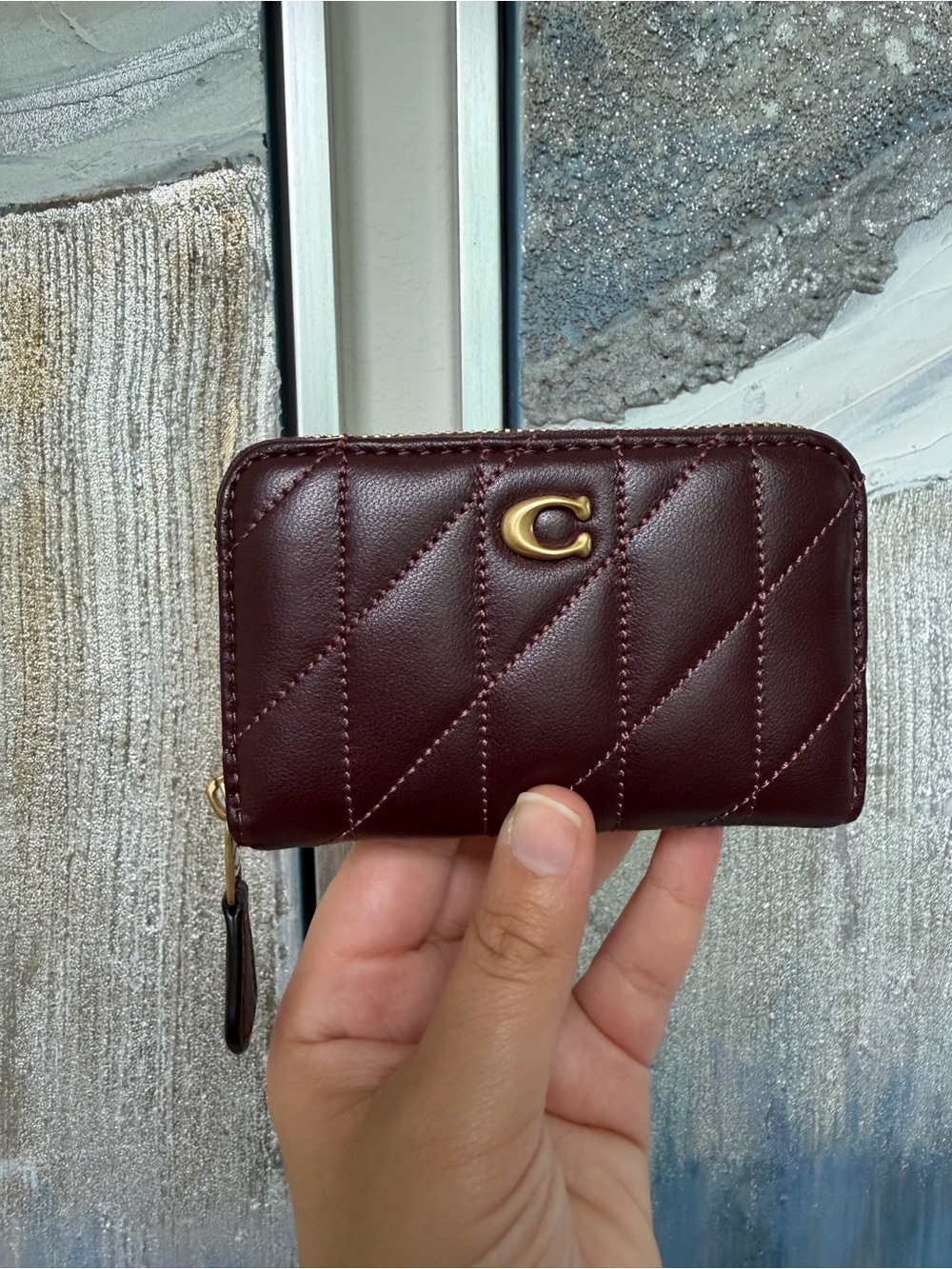Coach Quilted pillow small essential Zip Around card case black currant